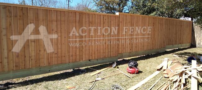 Board on board fence with cap and trim and kickboard