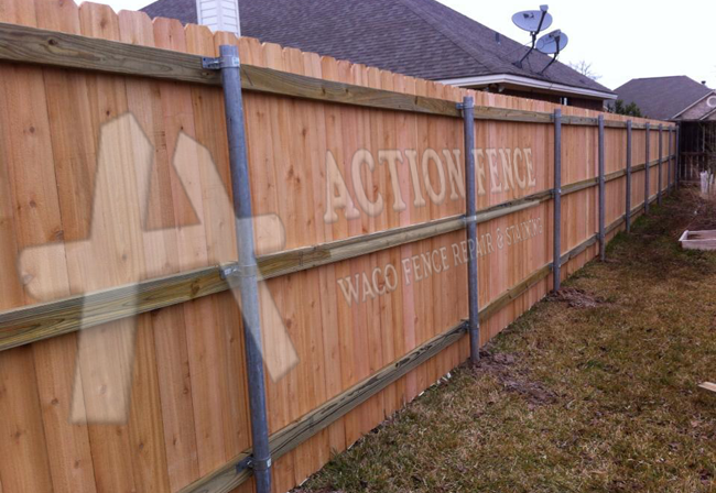 Cedar-picket fence with metal posts