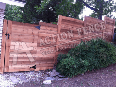 Horizontal board stair stepped cedar fence