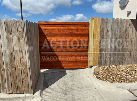 Horizontal stained cedar-board commercial gate