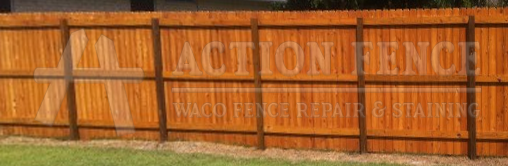 Stained cedar picket fence